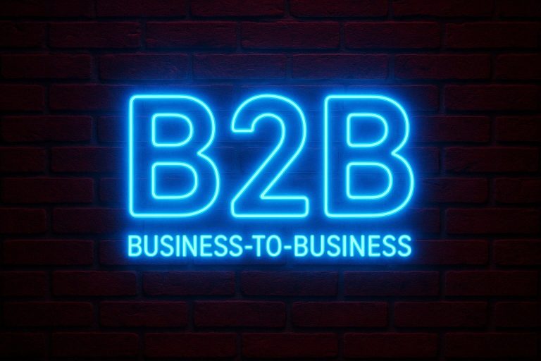 Business to Business "B2B" als Neonschrift auf Backsteinwand